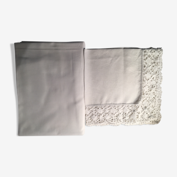 Old embroidered white linen and surnappe tablecloth
