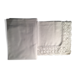 Old embroidered white linen and surnappe tablecloth
