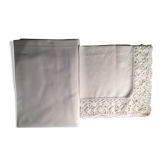 Old embroidered white linen and surnappe tablecloth