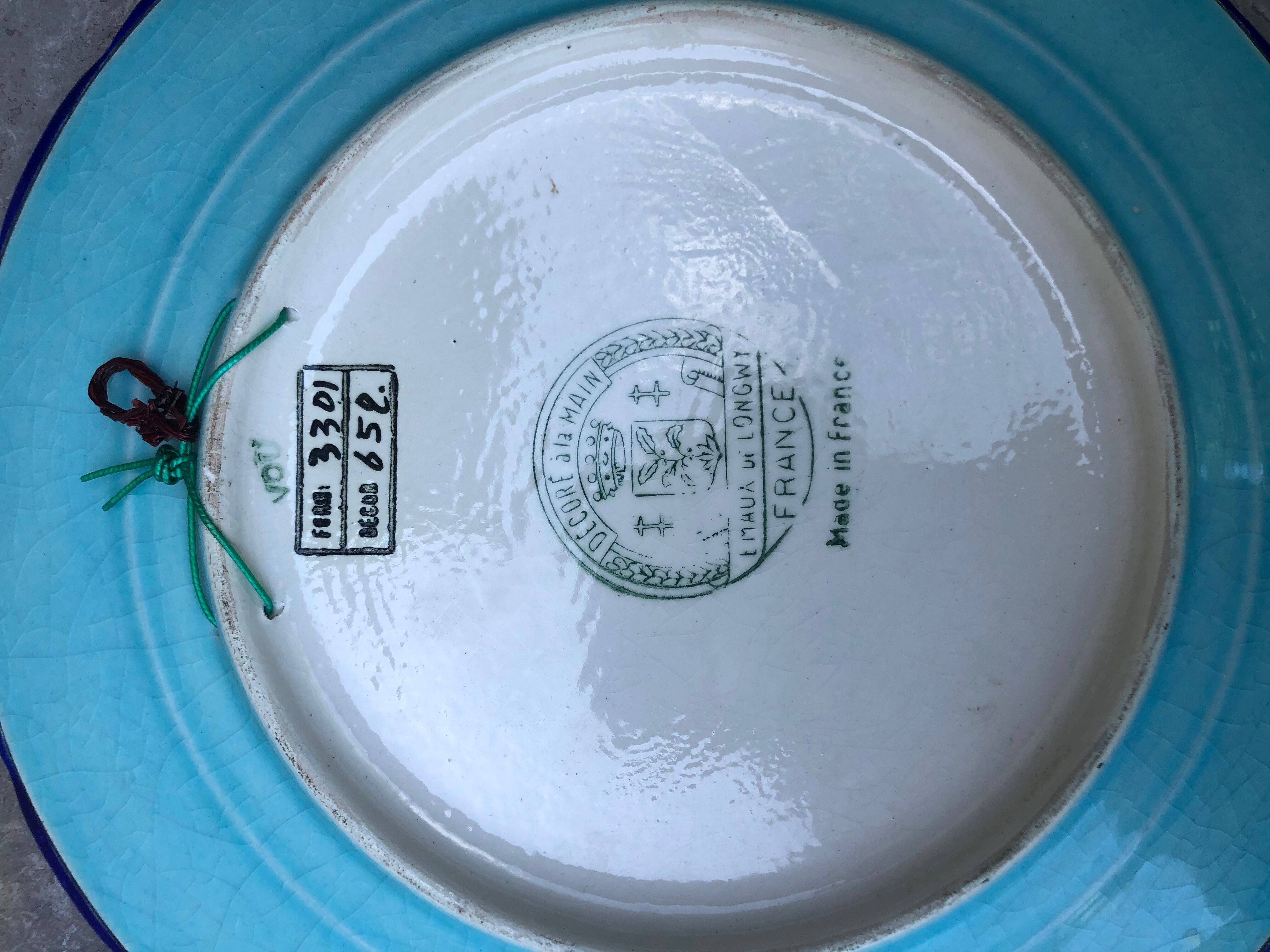 Plate in earthenware has naturalistic décor Longwy emaux