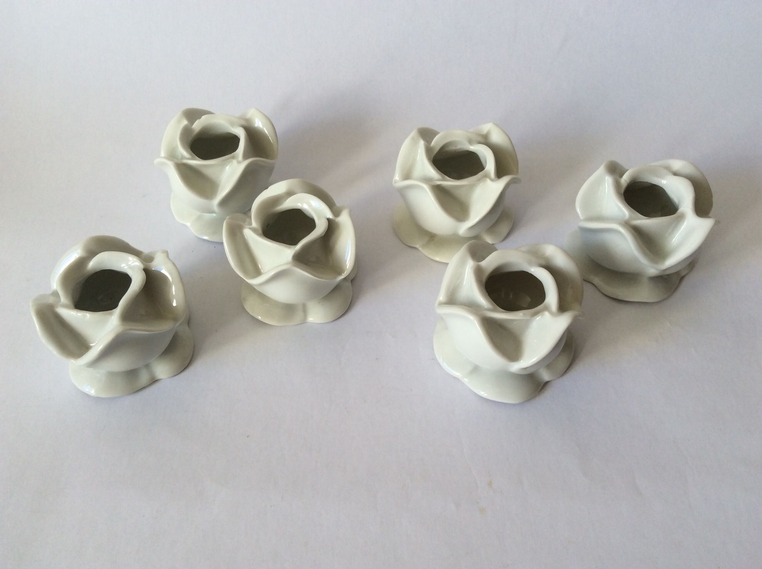 set of 6 pink candle holders in white porcelain