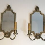 Pair of mirror and bronze wall lamps with lions' heads, french work. around 1940