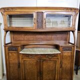 According to Gauthier-Poinsignon: large two-body buffet from the Art Nouveau period in walnut and burl.
