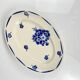 Oval half-porcelain plate from Badonviller, blue flower pattern, early 20th century.