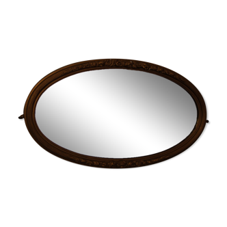 Miroir ovale biseauté en bois doré