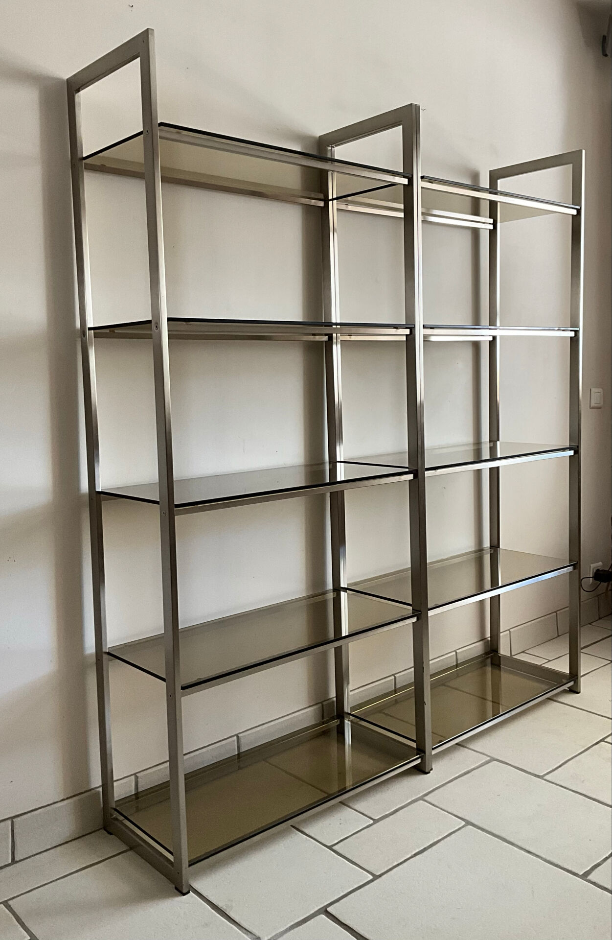 Pair of Artelano bookshelves in anodised metal and smoked glass, 1970s.