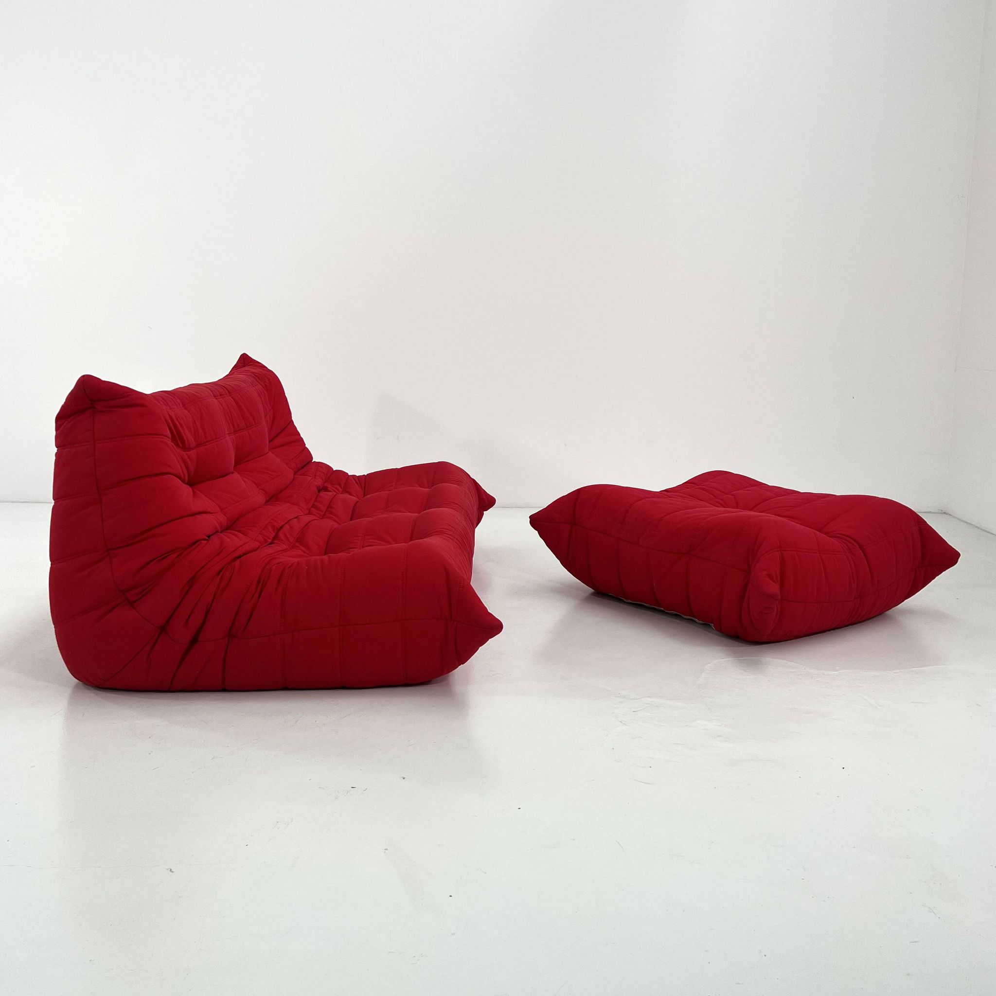 Togo 3-seater with red ottoman by Michel Ducaroy for Ligne Roset, 1970.