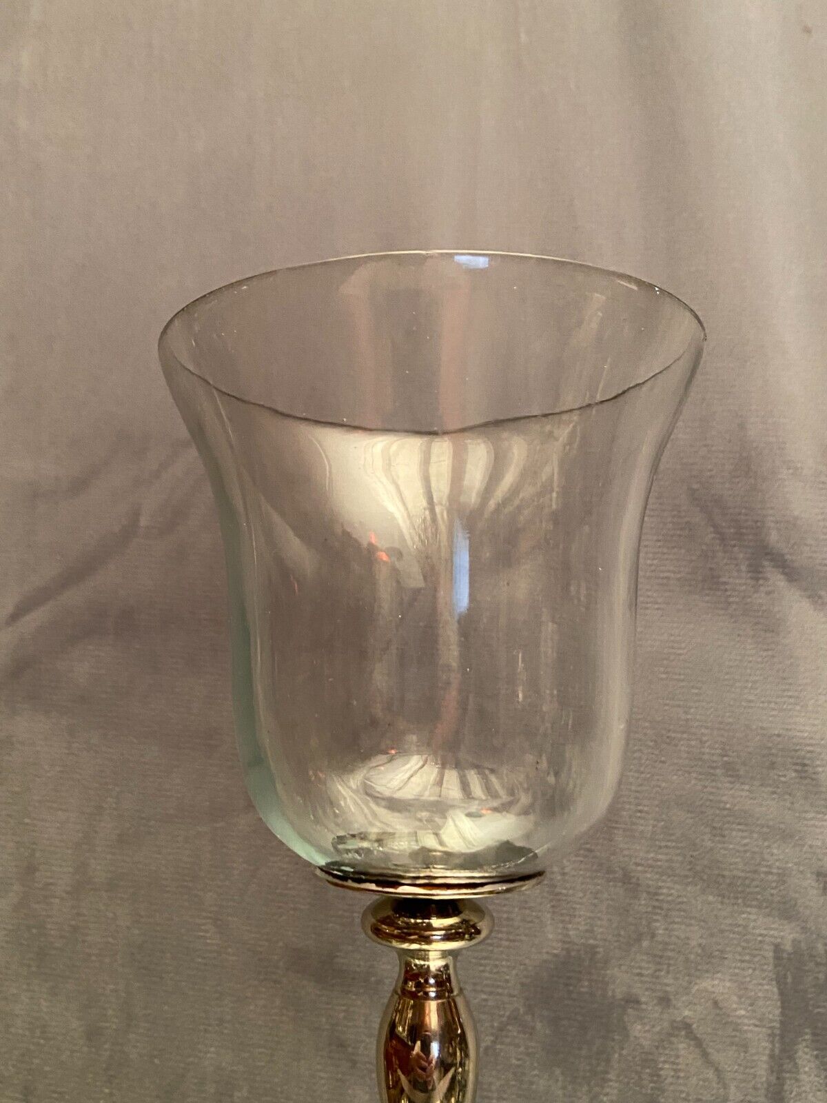 Glass photophore on high metal foot with silver patina