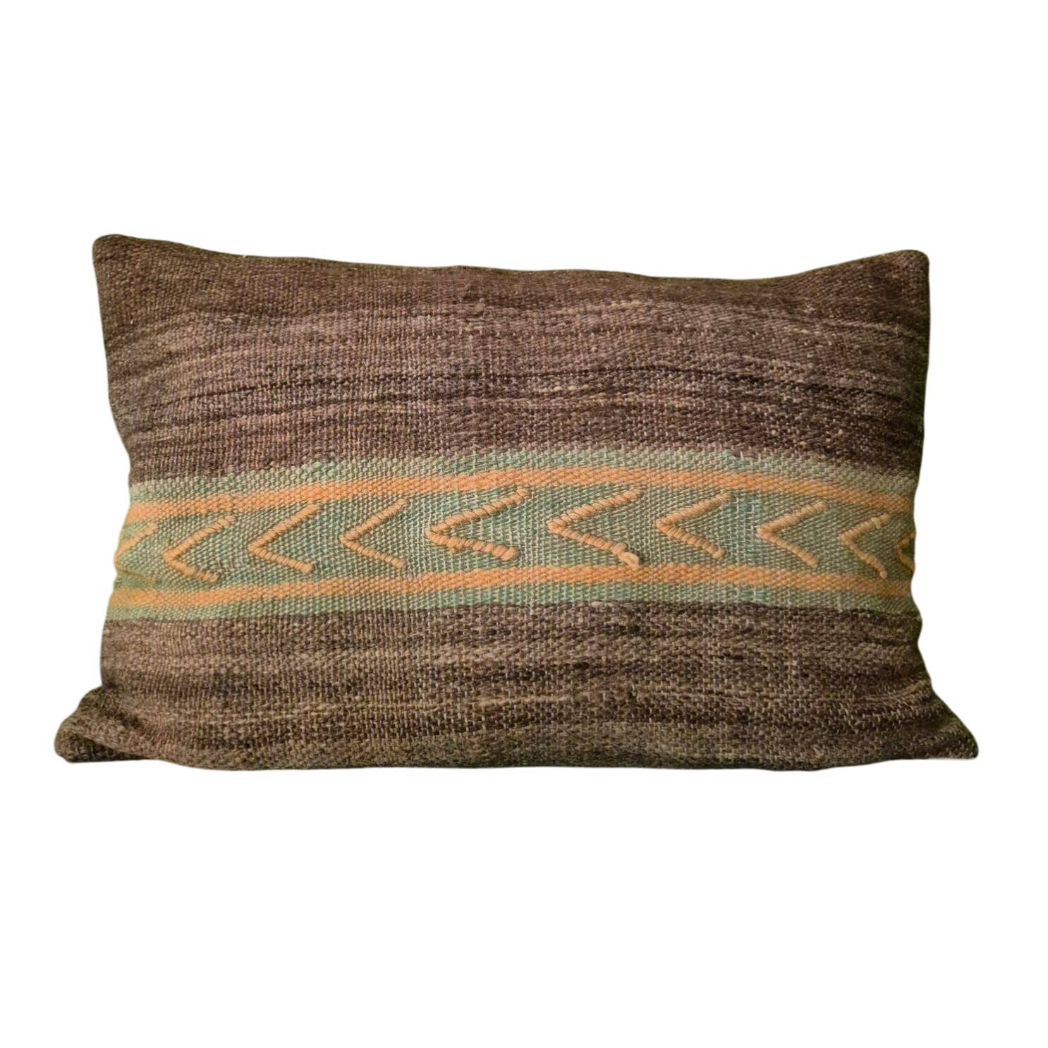Cushion cover in old Berber blanket.