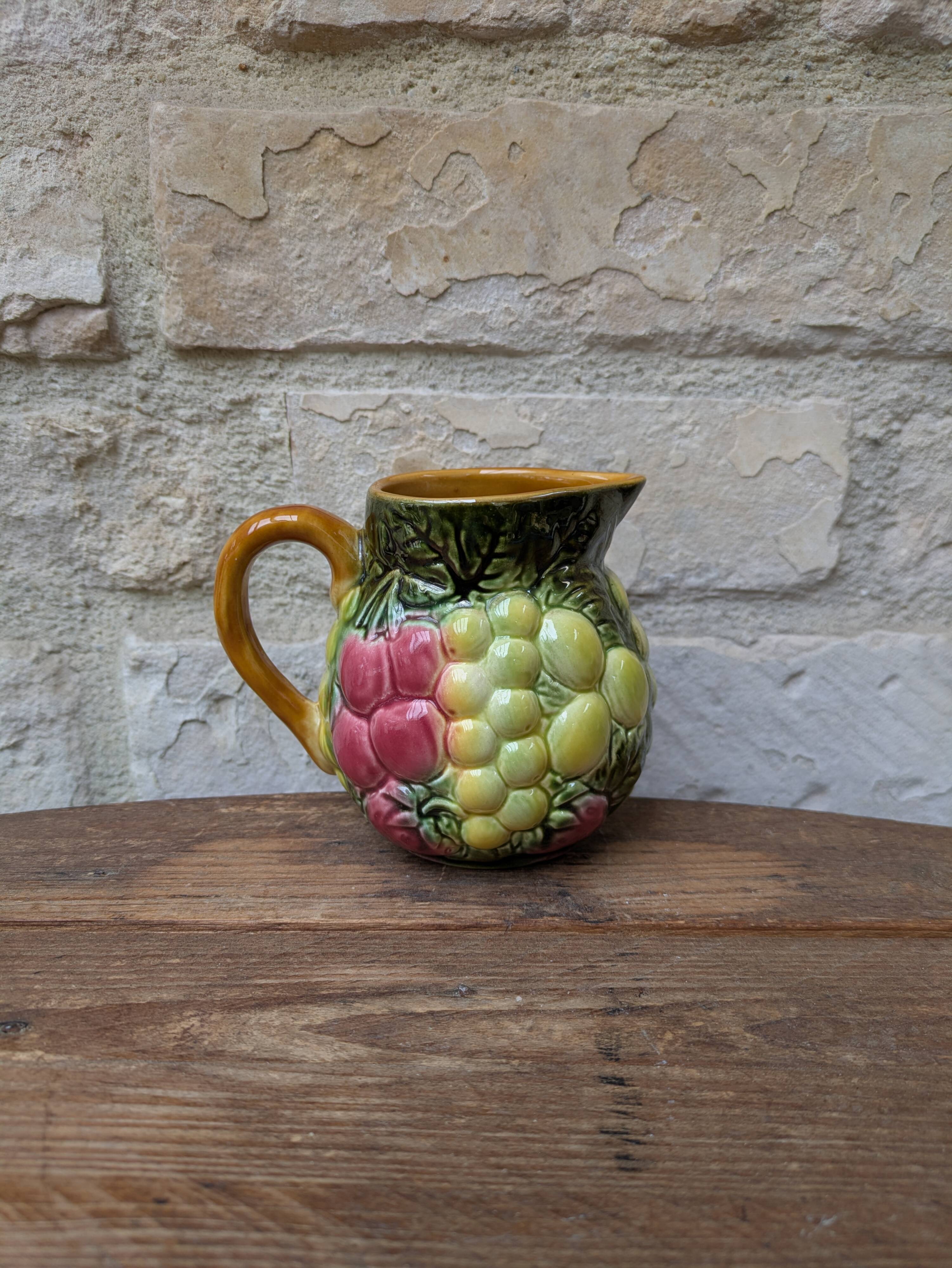 Small jug, milk pot in slipware with relief fruits Salins les Bains