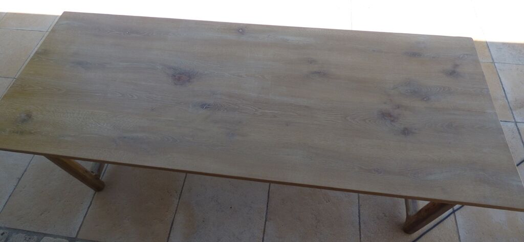 Large honey-colored farmhouse table in solid oak