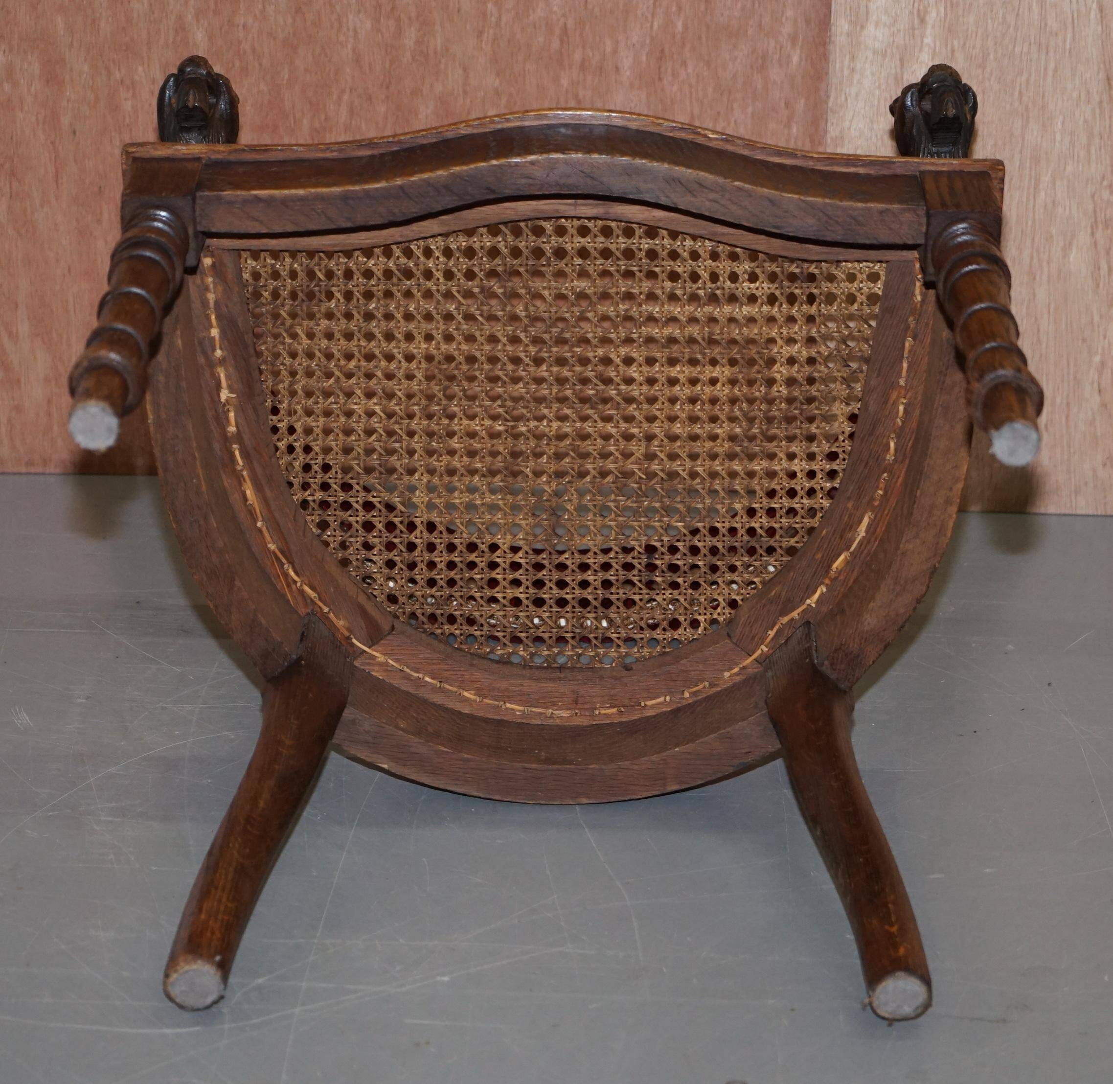 Antique Régence Bergère Armchair in Carved Oak with Lion Head Armrests