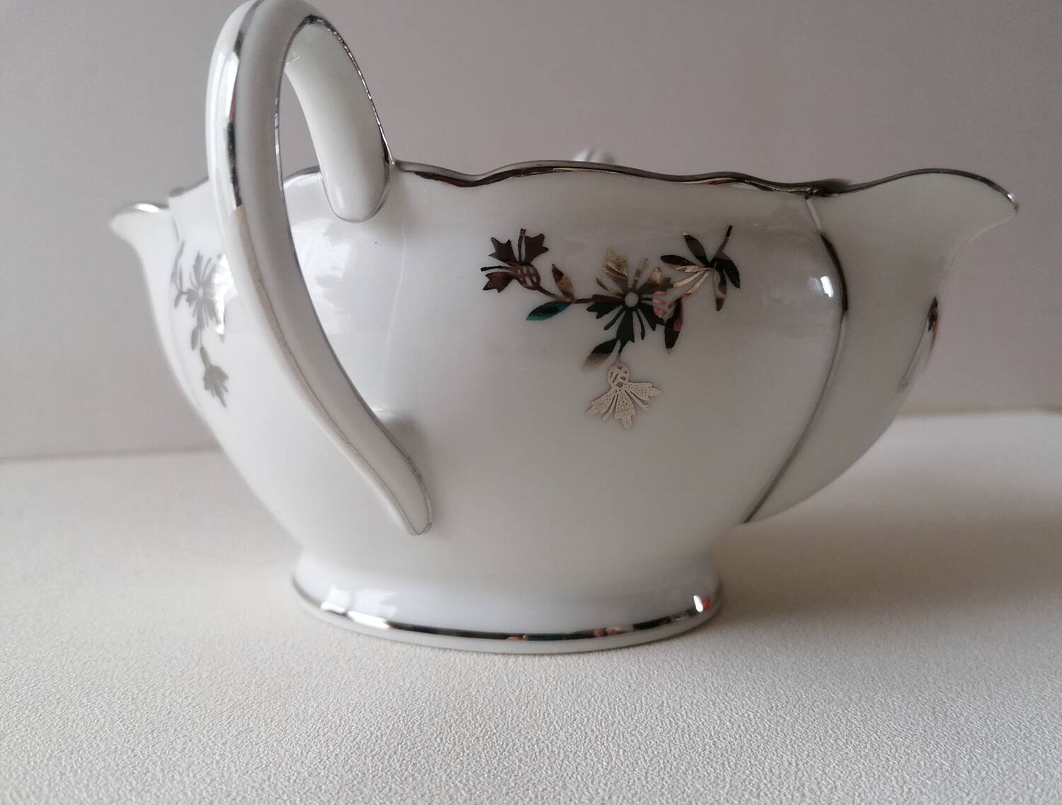 Limoges Maigre Gras porcelain sauce boat with silver decoration