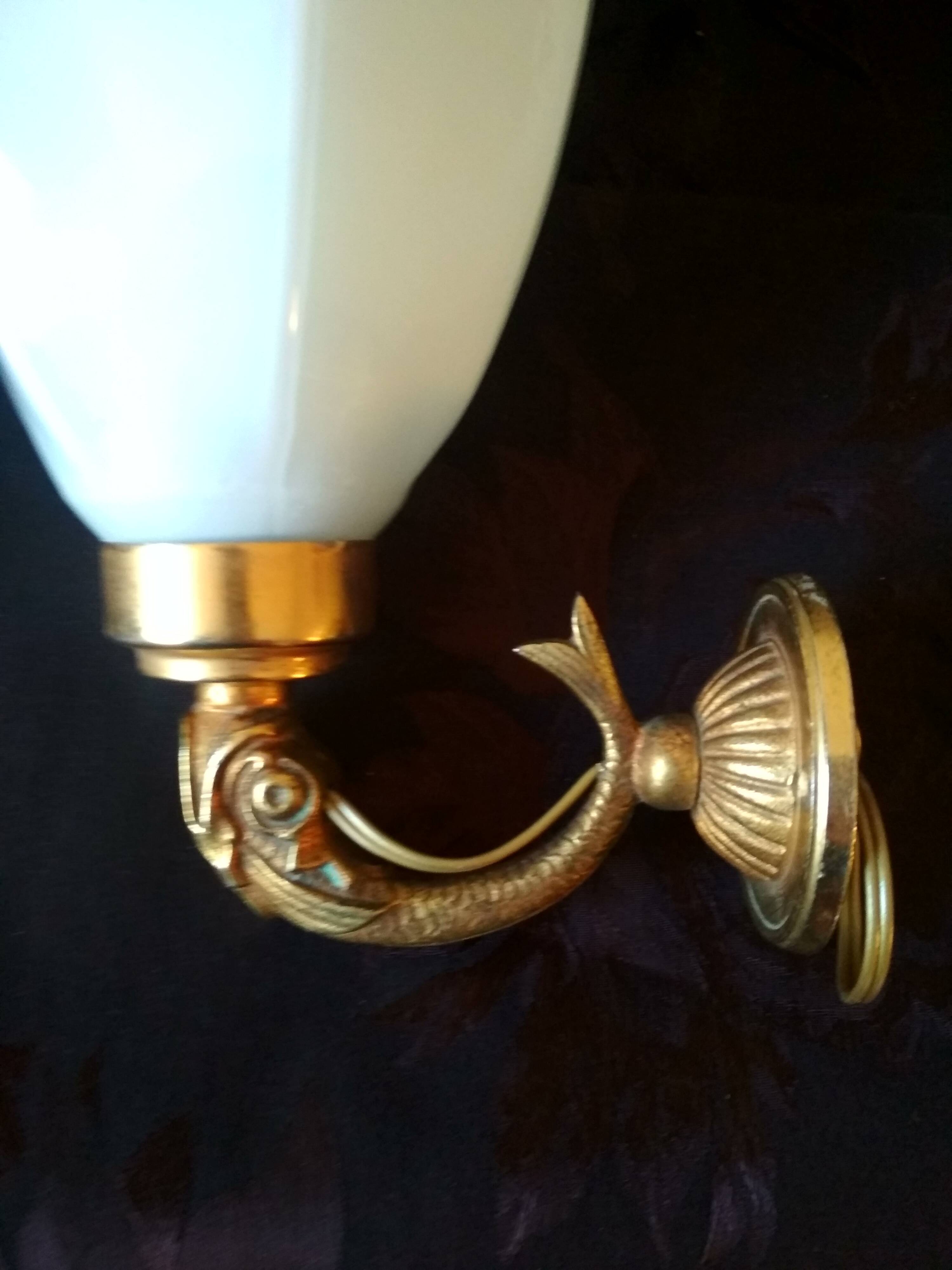 Golden brass wall light with glass tulip - dolphin pattern bathroom lamp