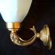 Golden brass wall light with glass tulip - dolphin pattern bathroom lamp