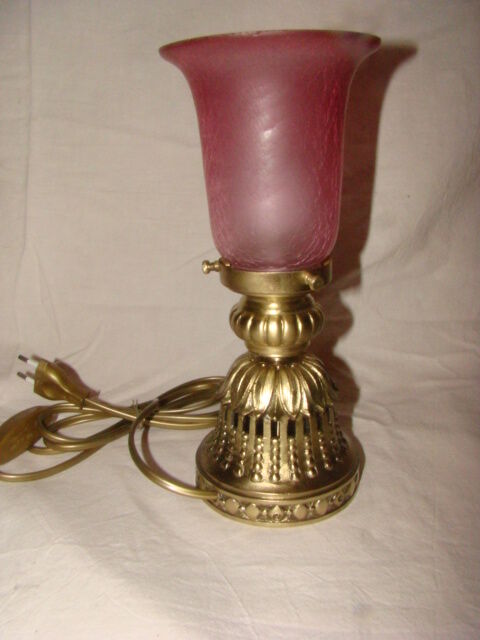 bronze bedside lamp with a pink cracked glass shade