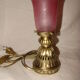 bronze bedside lamp with a pink cracked glass shade