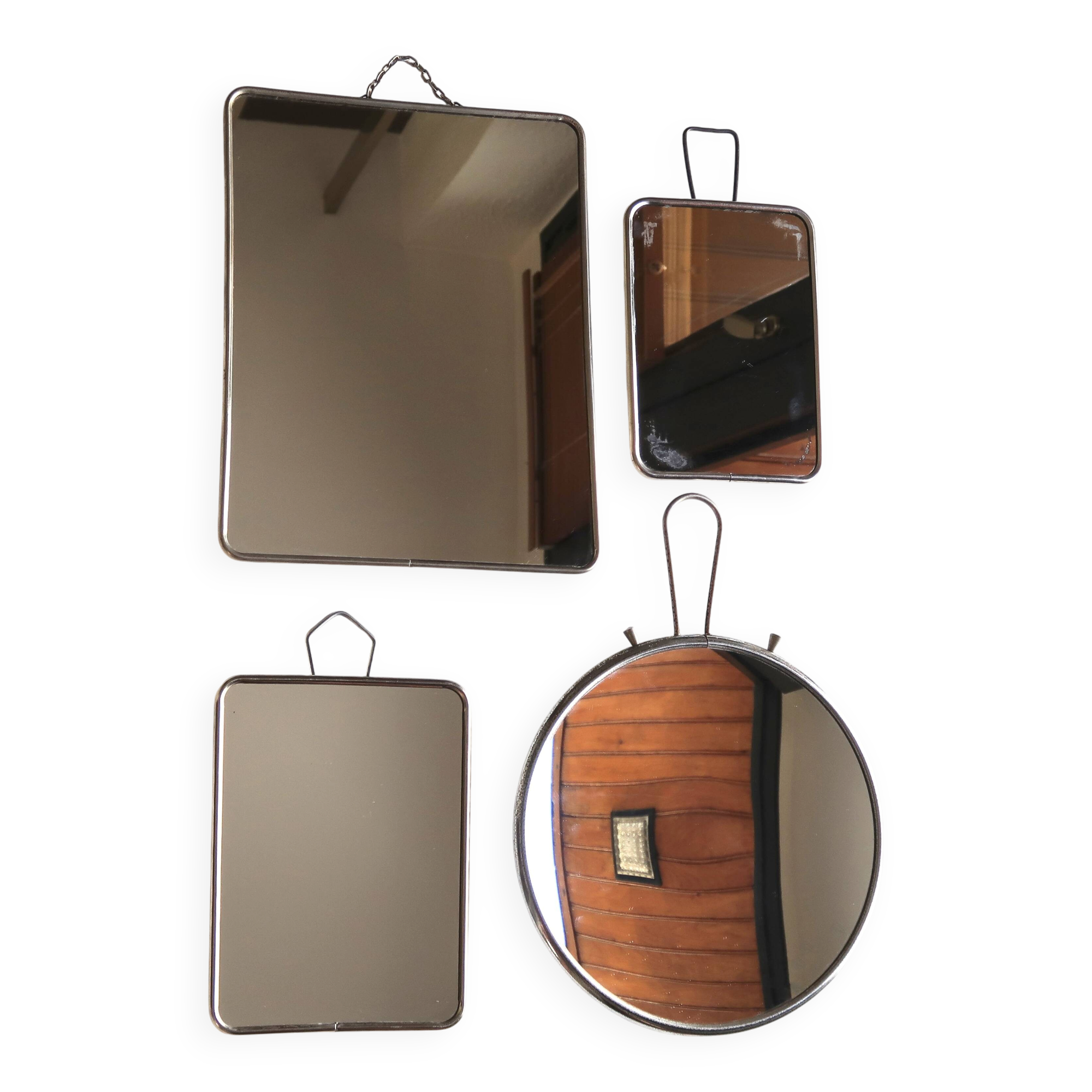 Set of four rectangular and round barber mirrors, 1950s.