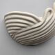 Draped ceramic wall light in a half-moon shape.