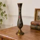Vintage brass soliflore vase with black, red, and green floral decoration – H 18 cm