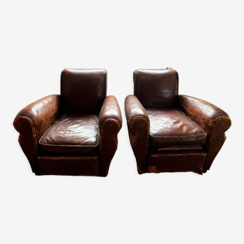 Paire de fauteuils club en cuir