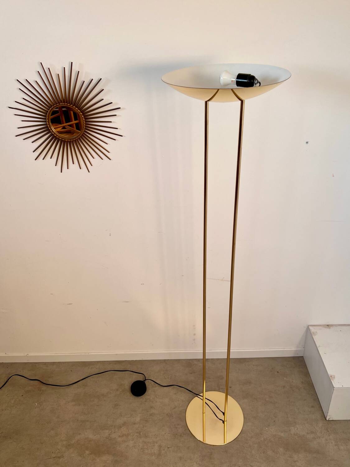 Old golden brass floor lamp with Italian design bulb from the 70s vintage