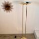 Old golden brass floor lamp with Italian design bulb from the 70s vintage