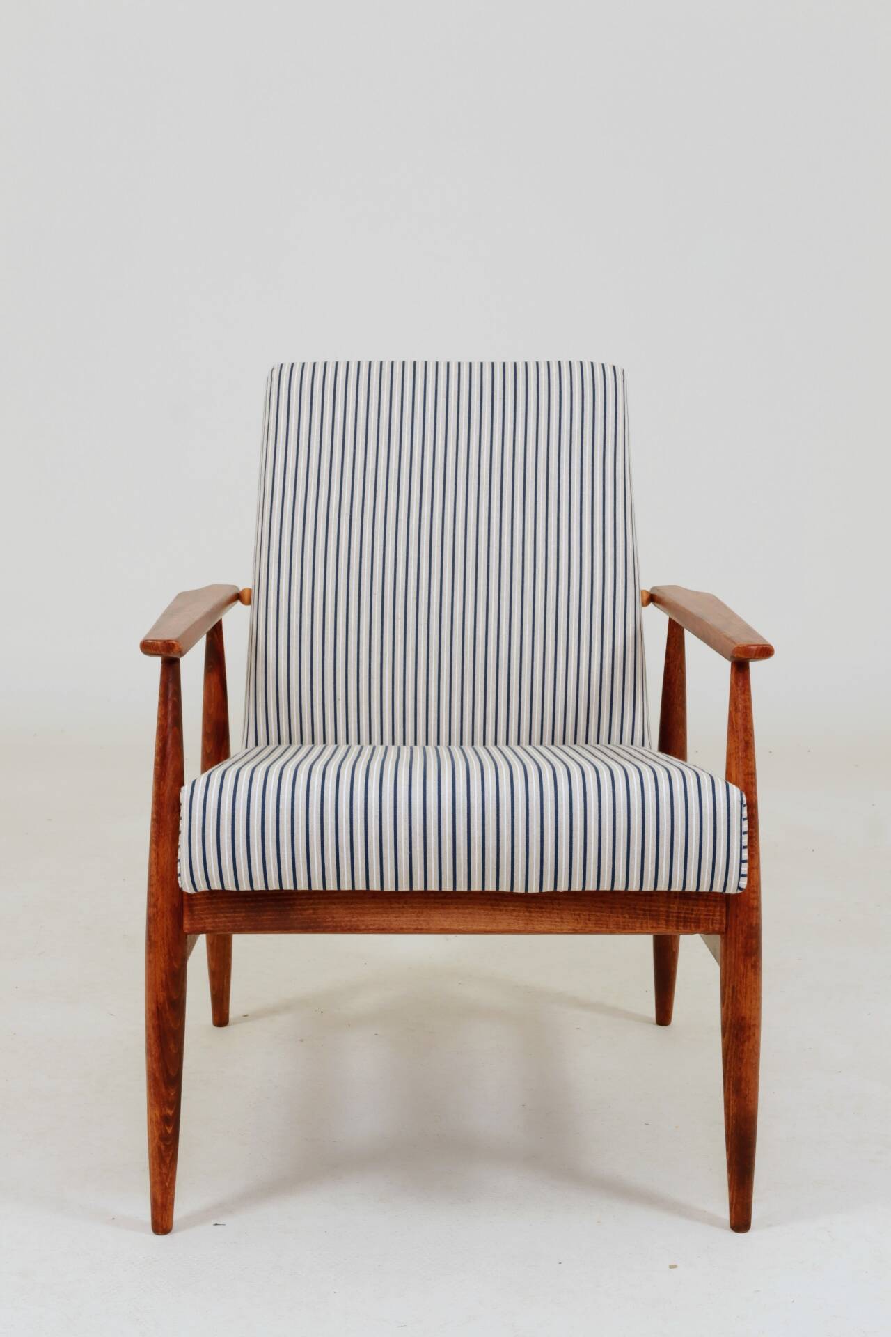 Armchair with striped fabric footrest, 1960