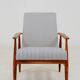Armchair with striped fabric footrest, 1960