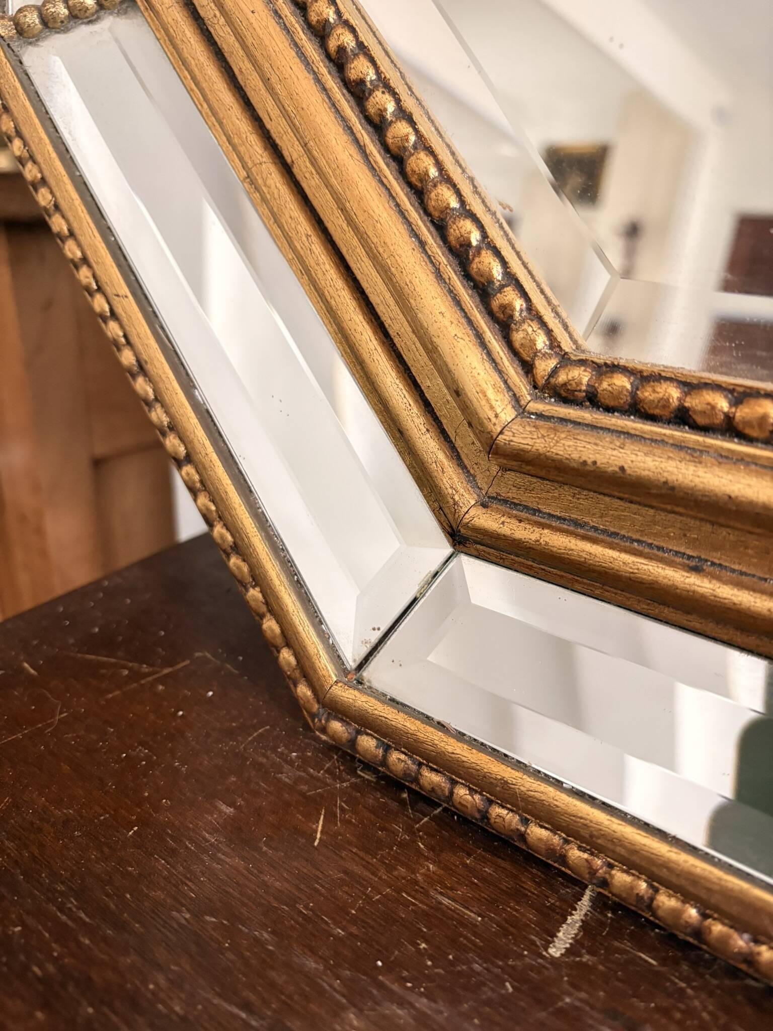 Octagonal mirror with bevelled parcloses, Neo-Classical Regency Art style.