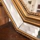 Octagonal mirror with bevelled parcloses, Neo-Classical Regency Art style.