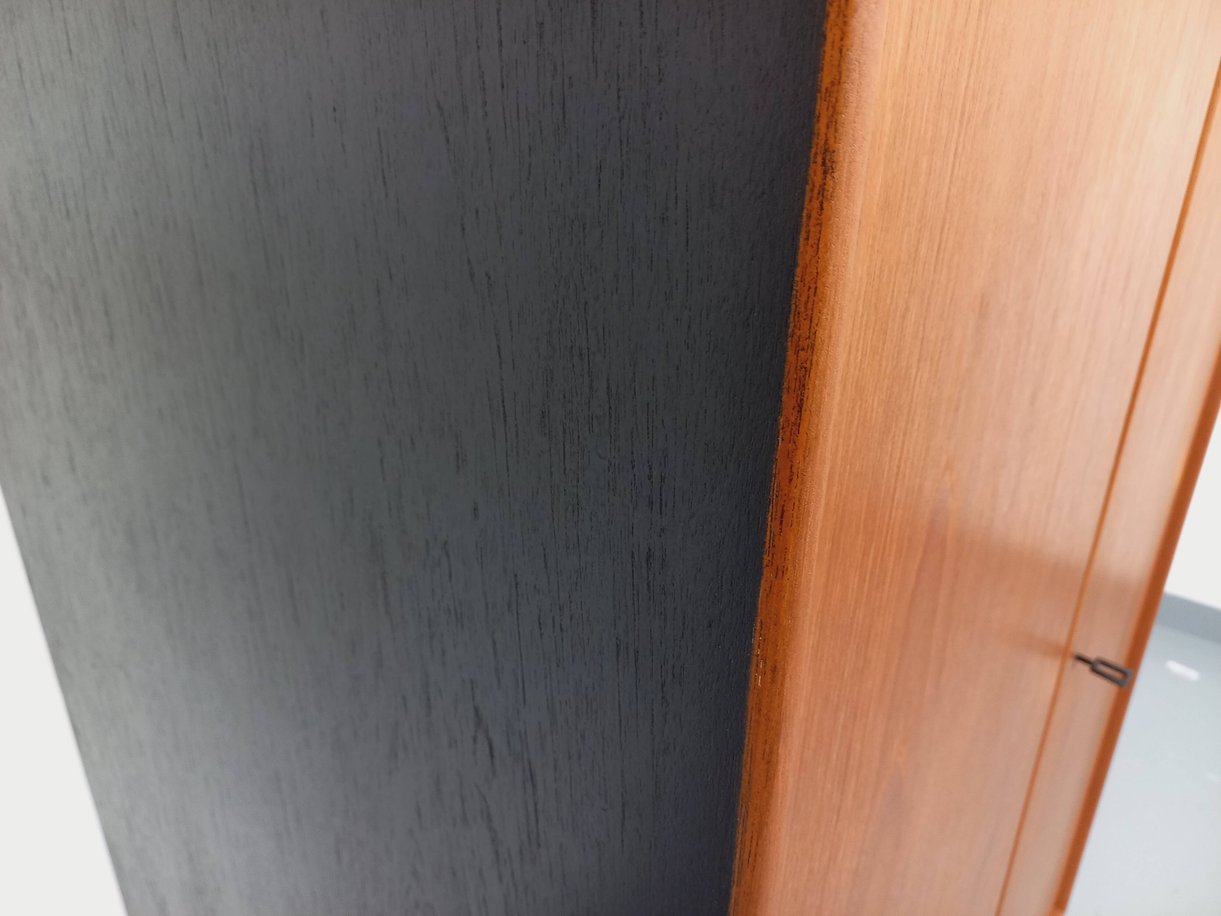 Vintage Scandinavian modernist wardrobe in teak and metal from the 1960s.