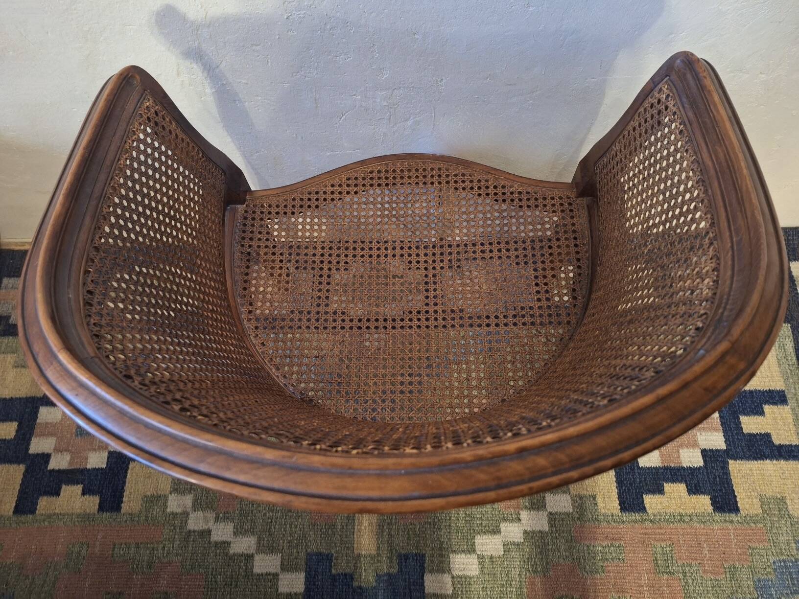 Half-moon rattan and hardwood armchair, early 20th century