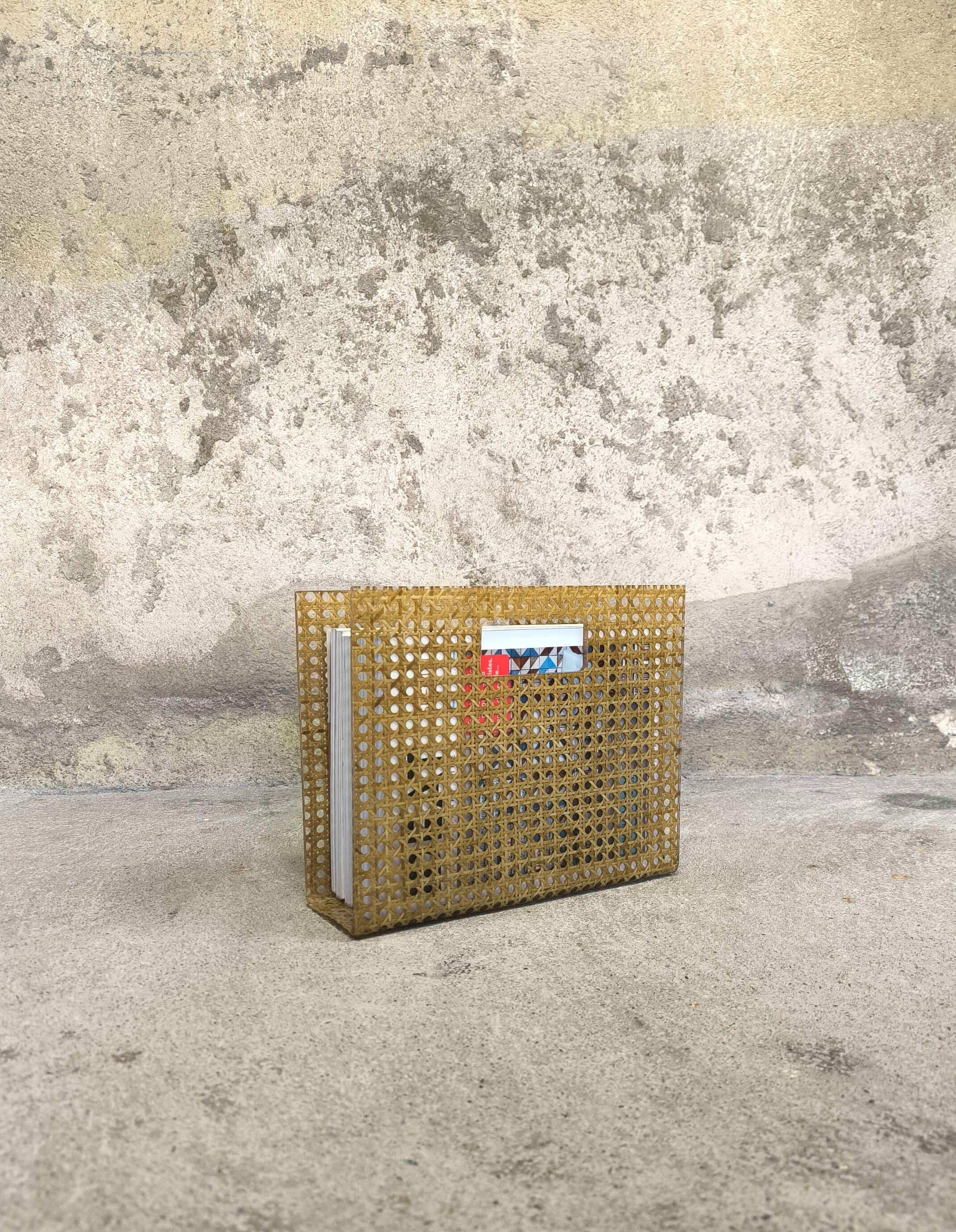 Vintage magazine rack in plexiglass and cane.
