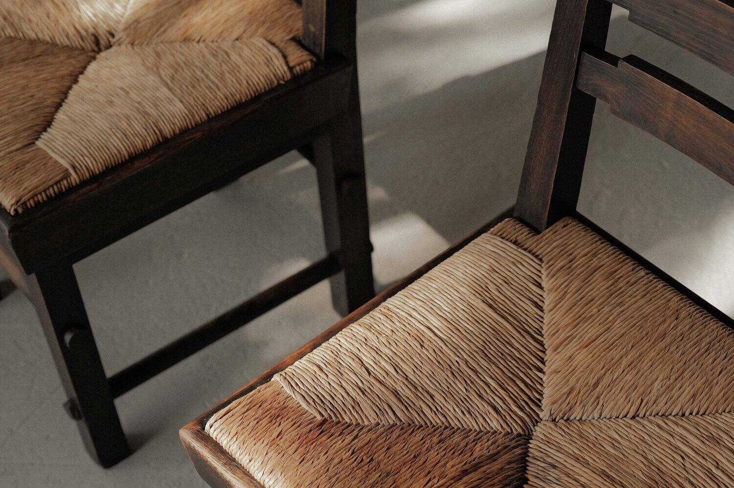Modernist chairs in oak and woven straw, France, circa 1948