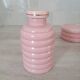 Set of pink and gold ceramic bathroom accessories