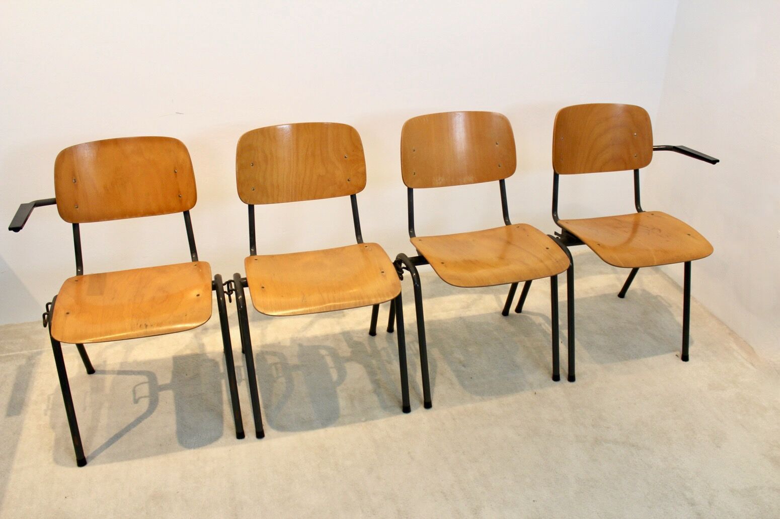 School bench consisting of 4 stackable chairs in industrial plywood by Marko Holland