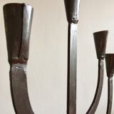 Old iron candelabra shaped high time