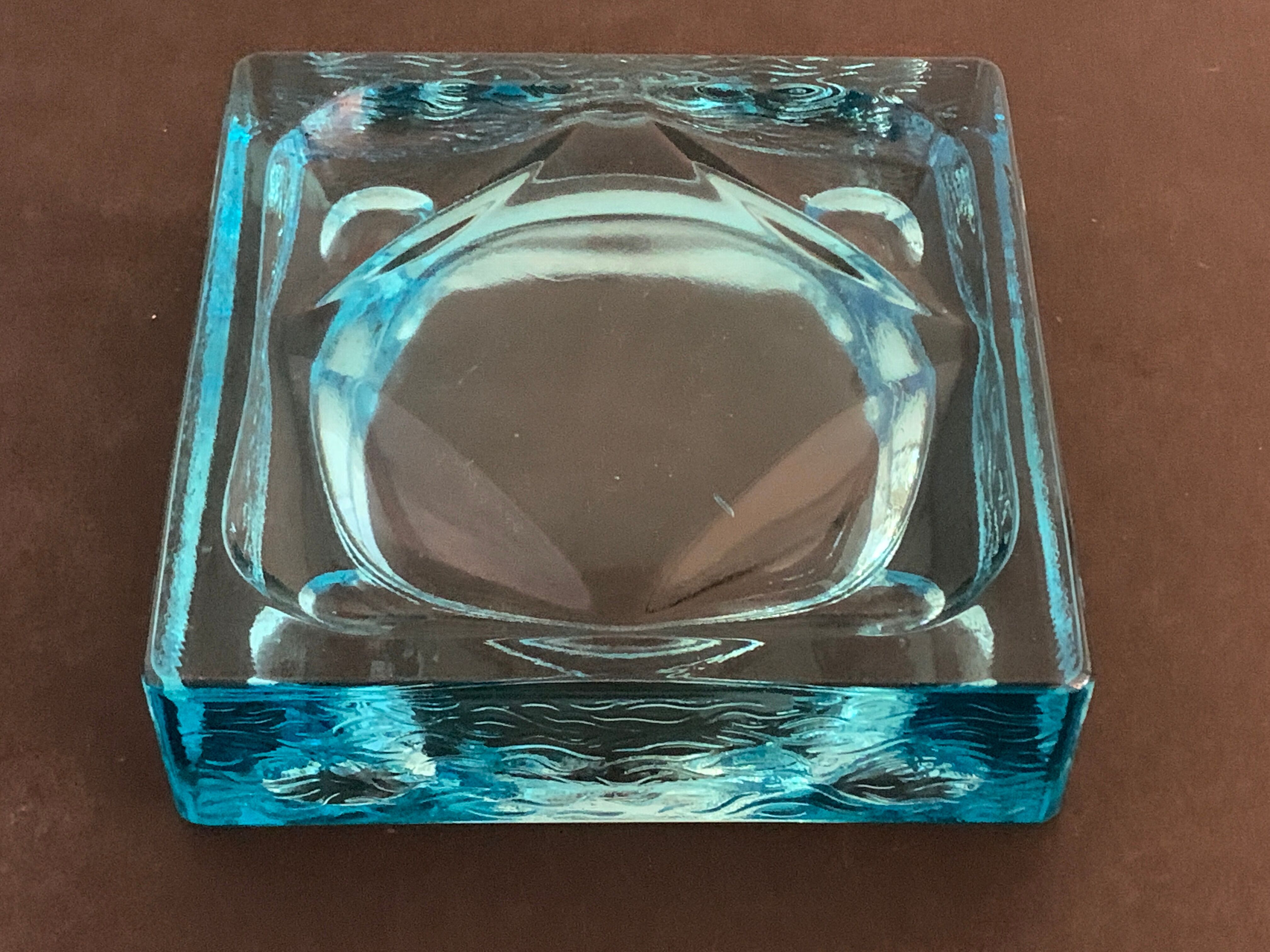 Ashtray paved in blue glass