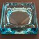 Ashtray paved in blue glass