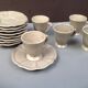 Batch of 5 coffee cups and mole patinated saucers Put in Home