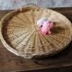 Large round wicker tray with two handles, vintage weaving.