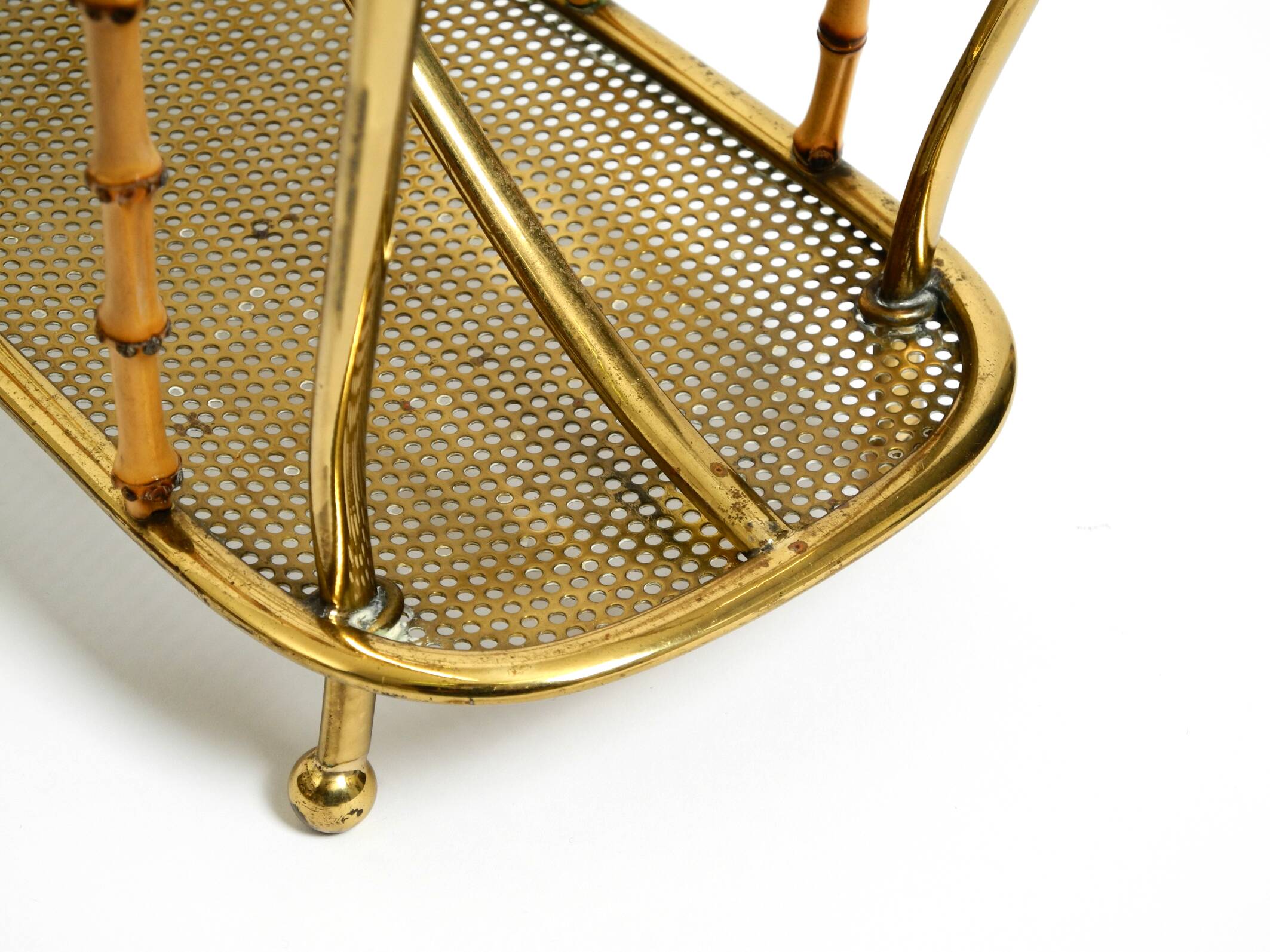 Rare Mid Century Modern magazine rack made of solid brass and genuine bambo