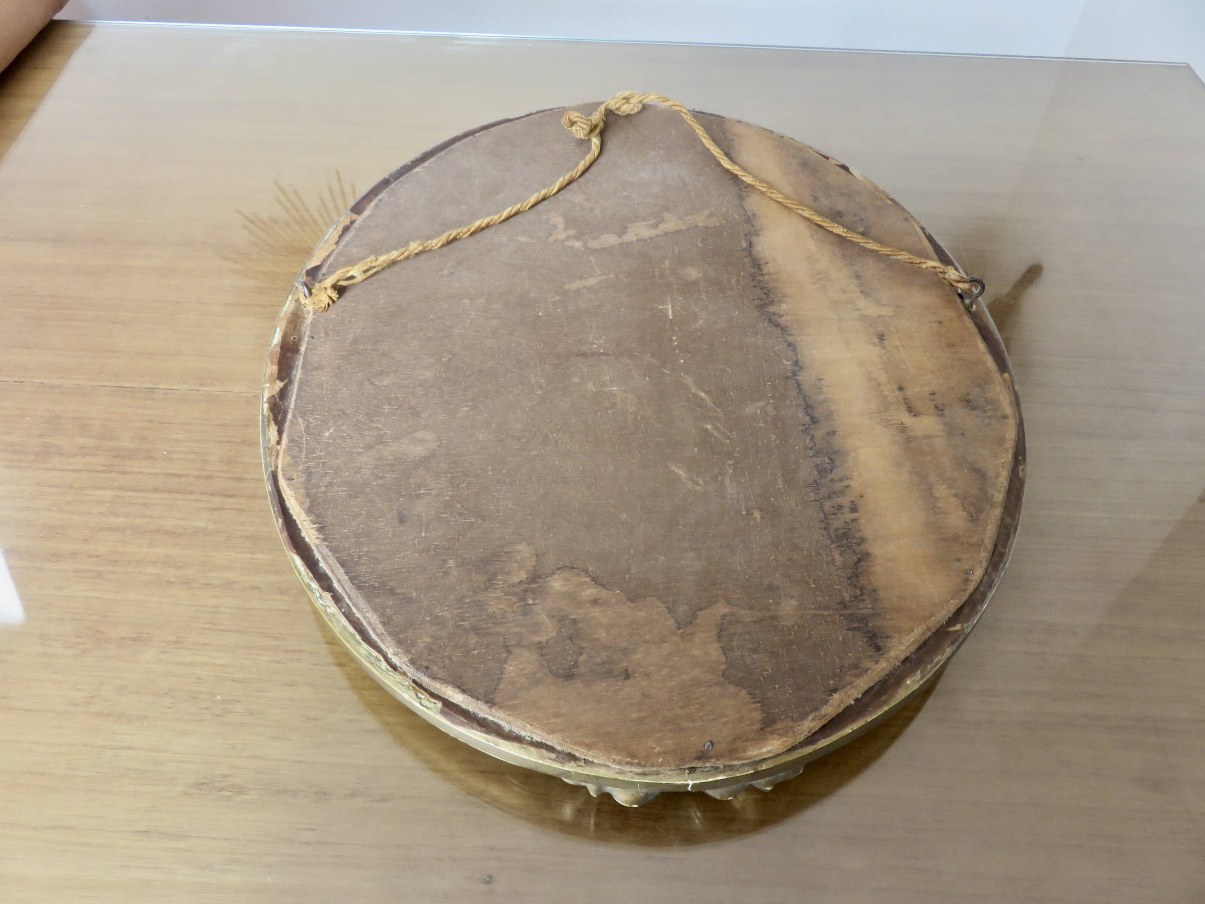 Oval wall mirror, golden floral pattern in stucco and wood, late 19th century