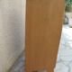 Vintage chest of drawers in raw wood.