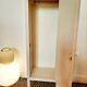 Antique tall cabinet painted white