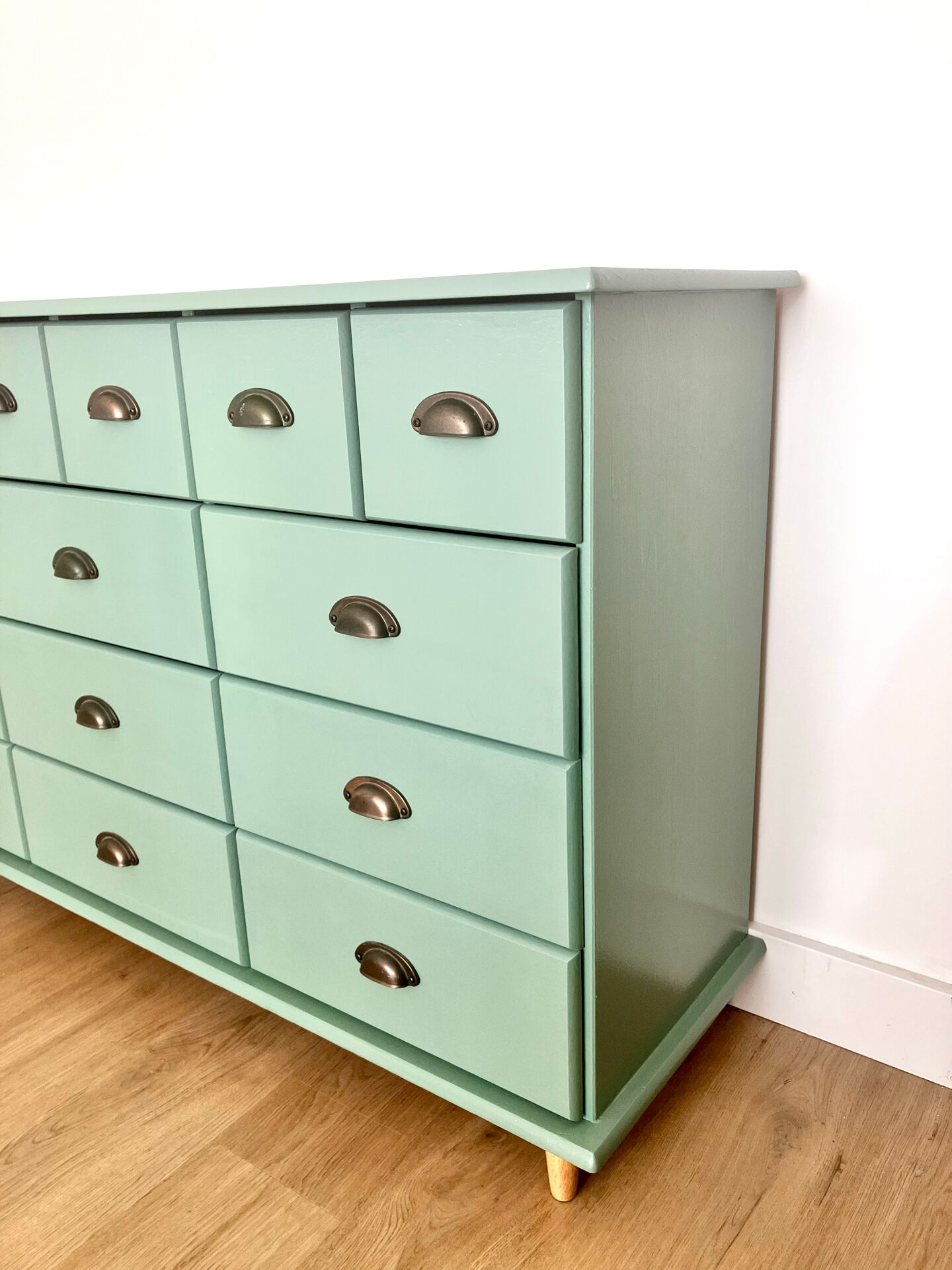Low buffet with patinated gold handles.