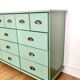 Low buffet with patinated gold handles.