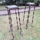 Pair of Brutalist patinated iron and veined marble columns, 1960s