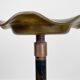 Brass ashtray on metal stand and wooden base